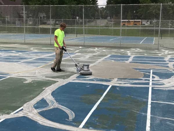 Working resurfacing pickleball court