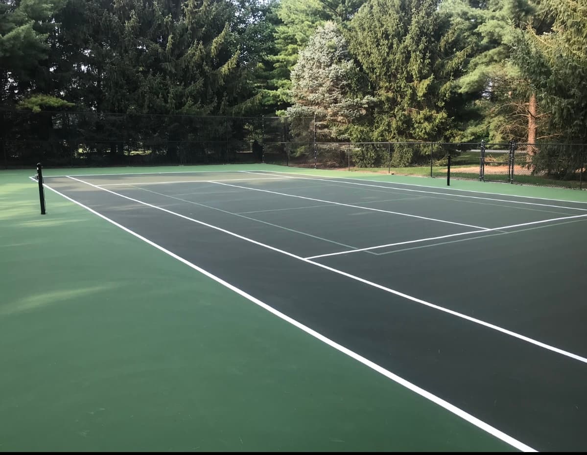 New backyard tennis court installation